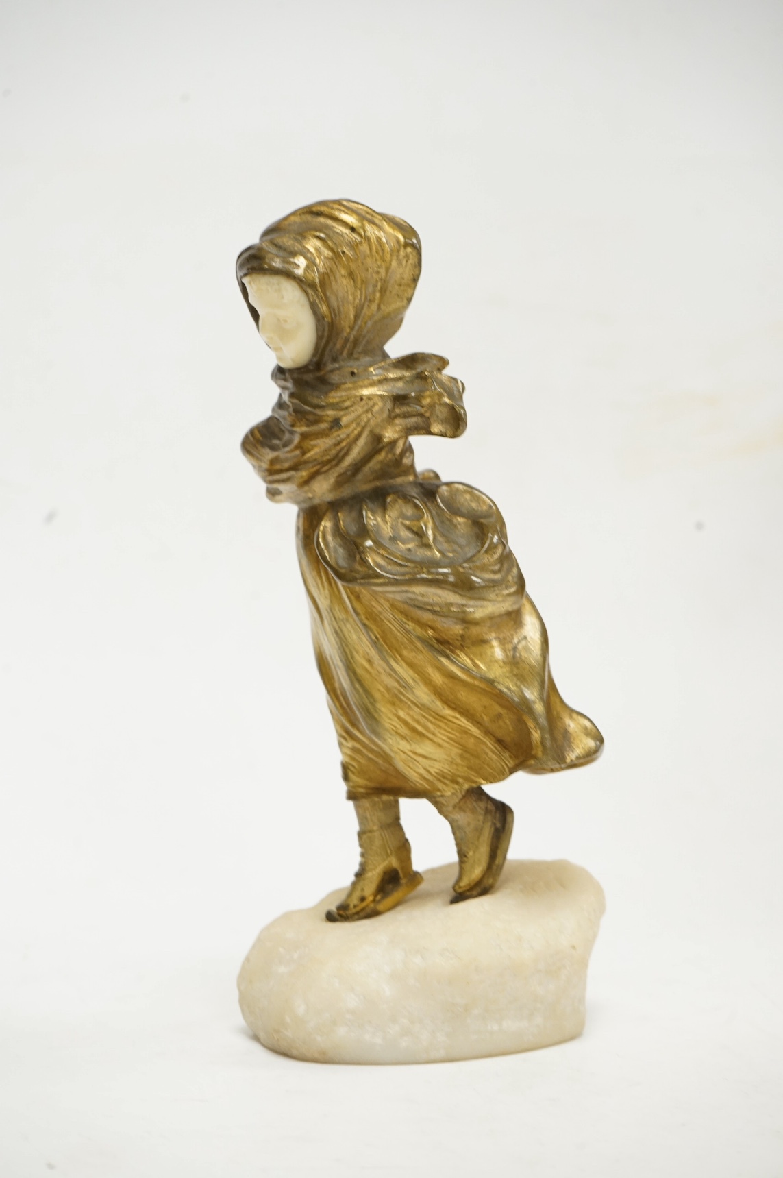 After Affortunato Gory, a bronze and ivory figure of a windswept skating girl, incised script signature to granite base, 19cm high. CITES Submission reference LWATX8X8